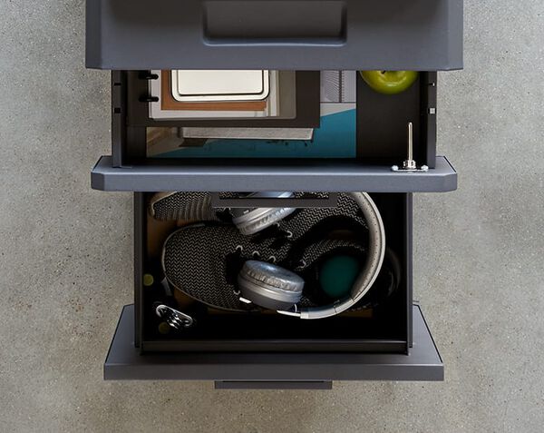 two drawers seen from top with files and office supplies