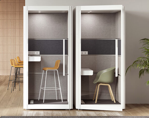 two one person privacy booths with chair set at the workstation height 