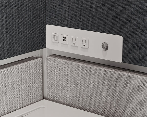 shelf with two ac outlets one usb a port and one port usb c inside of privacy booth