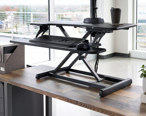 electric converter in raised position on top of a desk