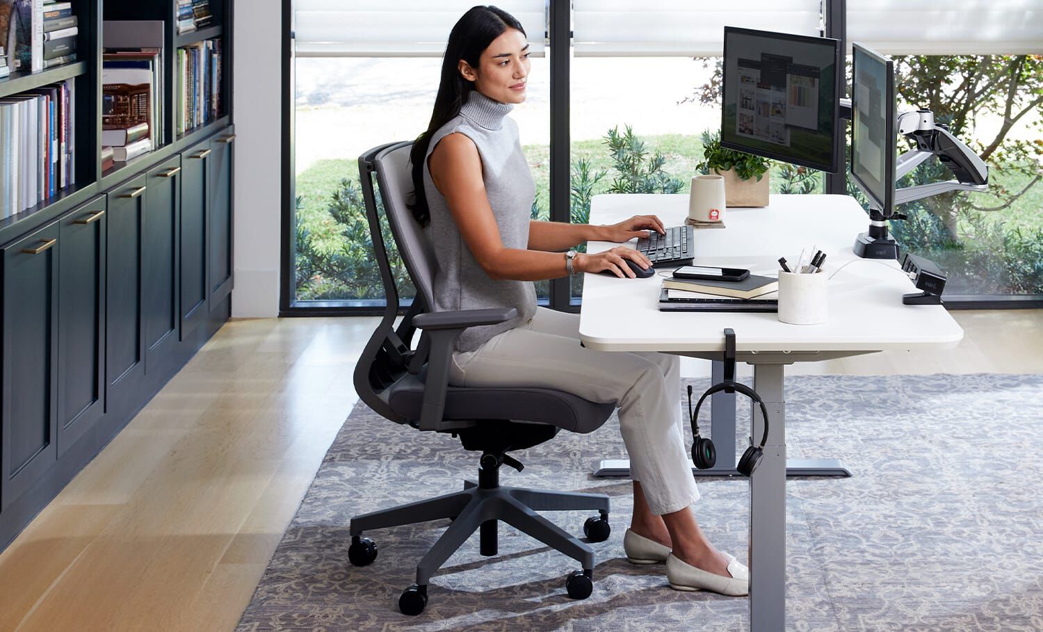 Professional individual sitting in an office Task Chair working at a desk.