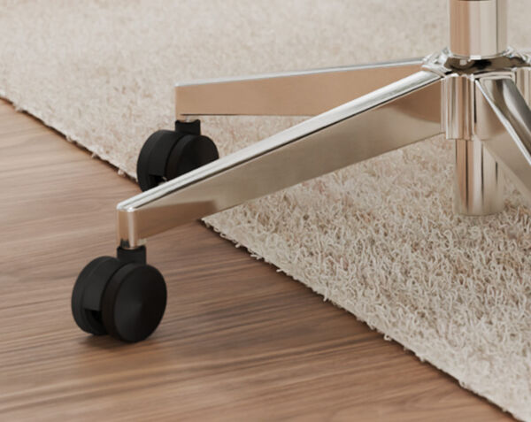 close up view the casters at the bottom of the vari tempur pedic upholstered chair