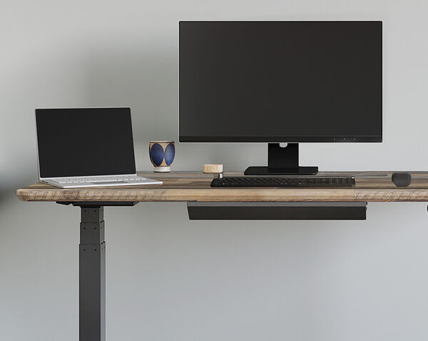 vari desk drawer shown under a electric standing desk