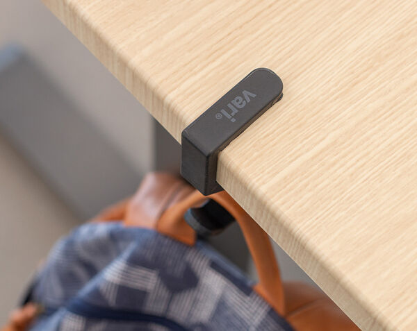 overview of the vari desk hook clasped to a desk or table