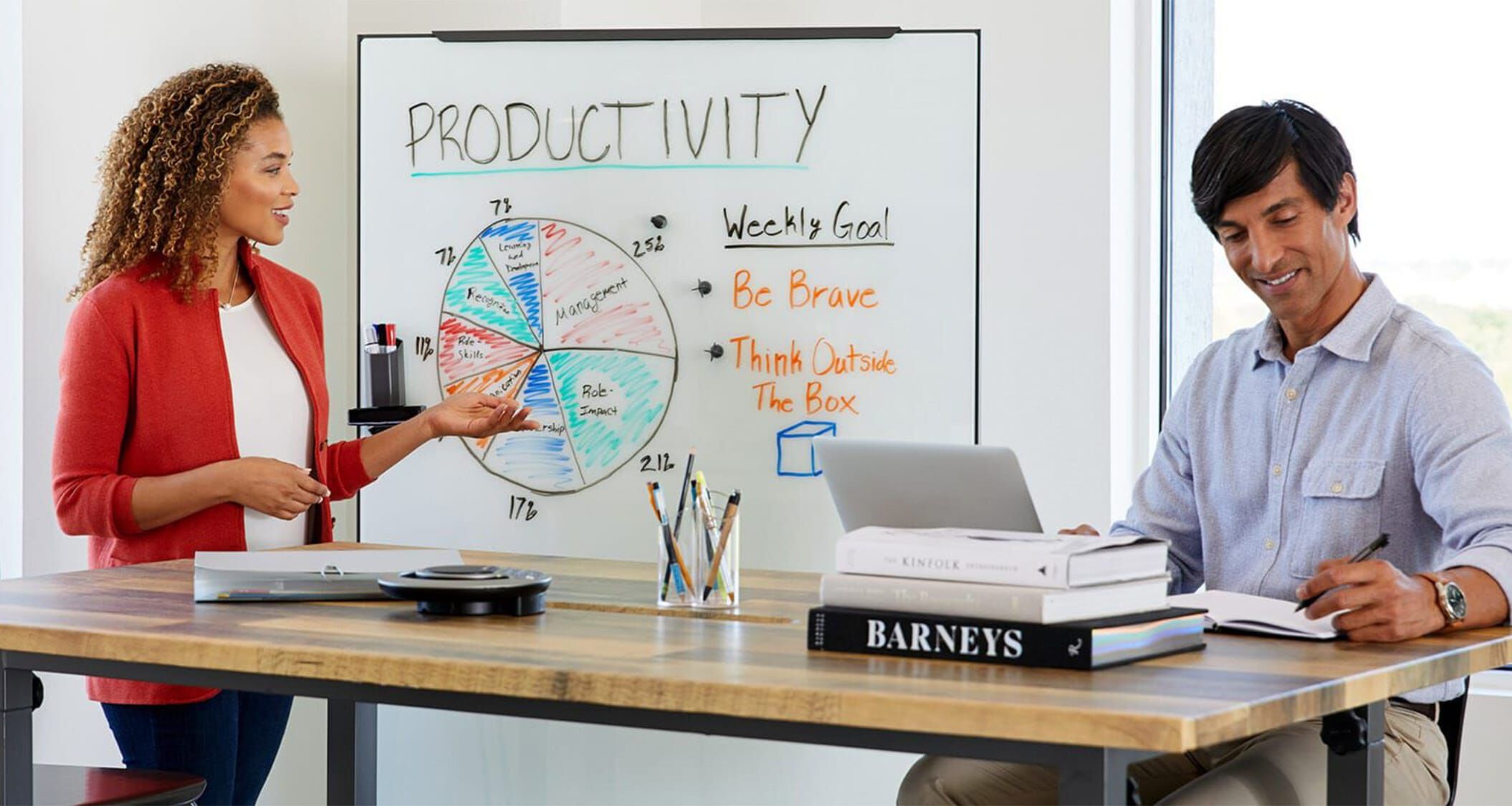 two professionals meeting in a conference room