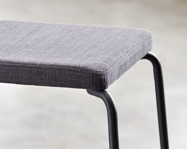 cushion is perched on top of frame with heavy-duty upholstery fabric