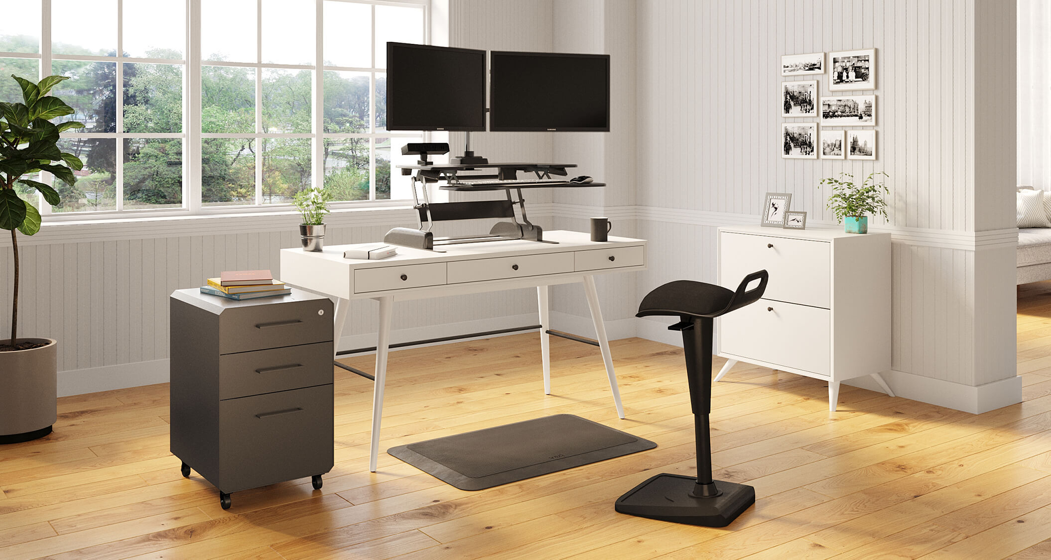 Converter placed on existing desk to create sit-stand home office