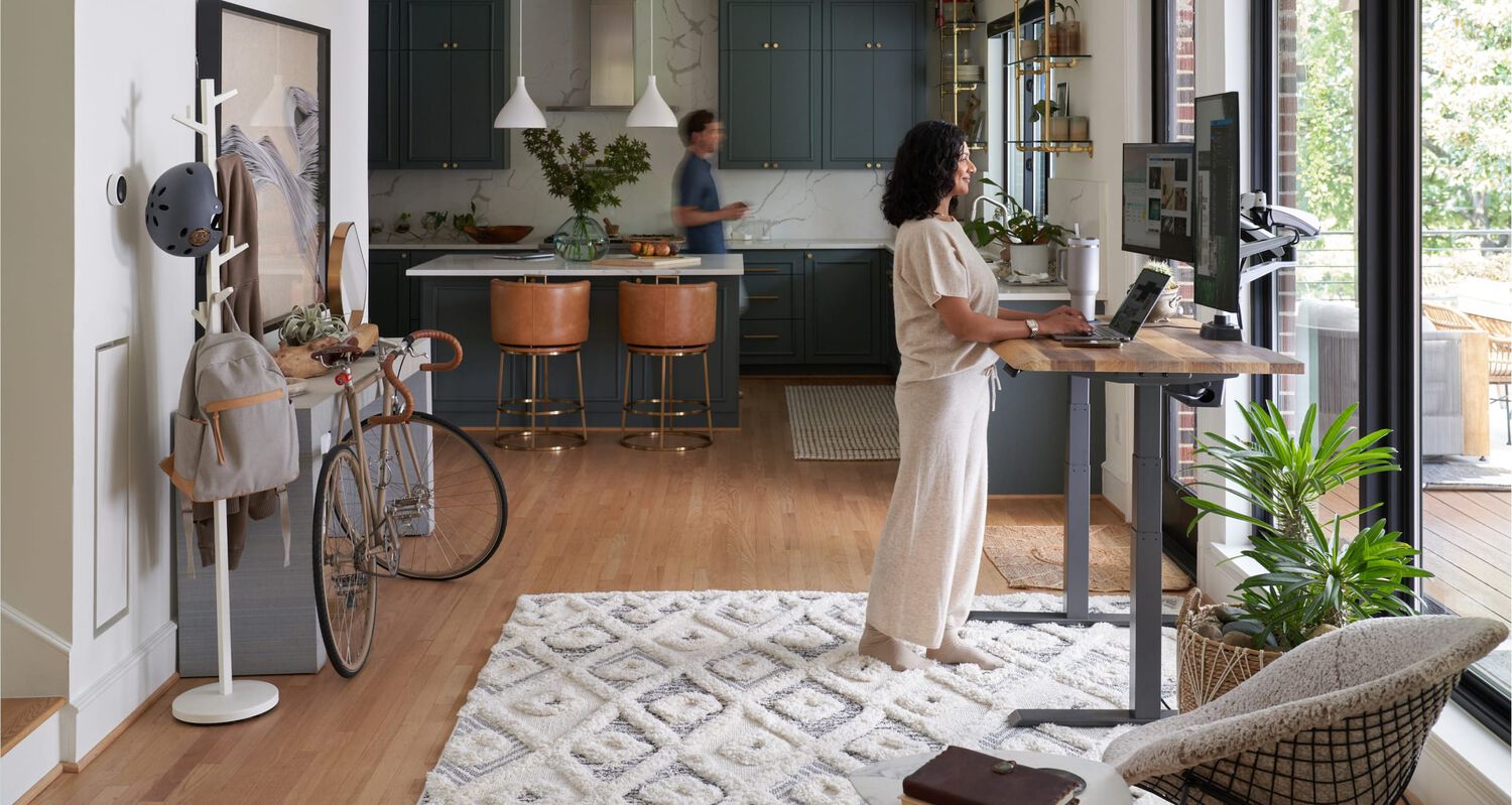 vari electric standing desk in use within a home setting