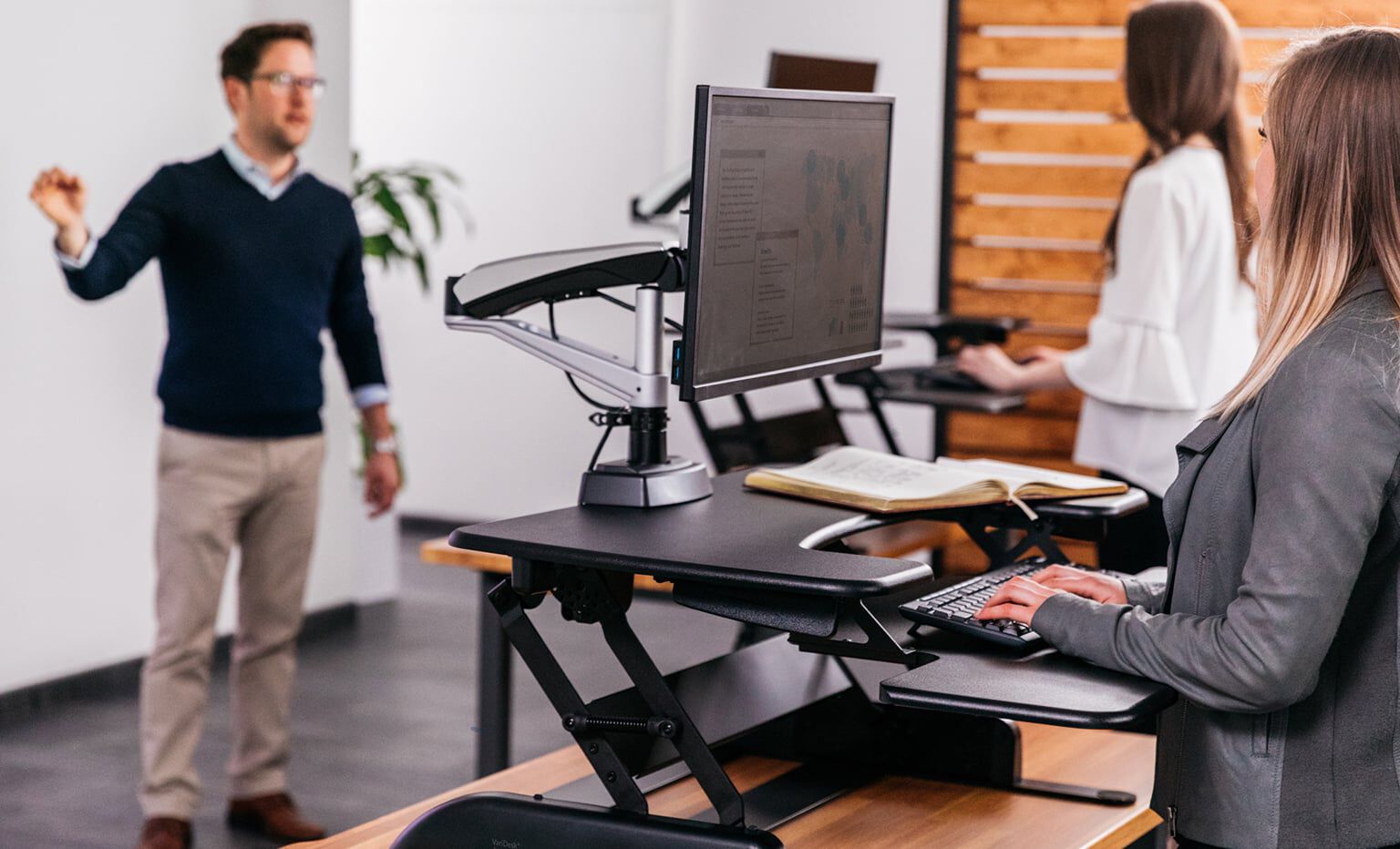 varidesk standing desk converter in use in a higher education classroom setting