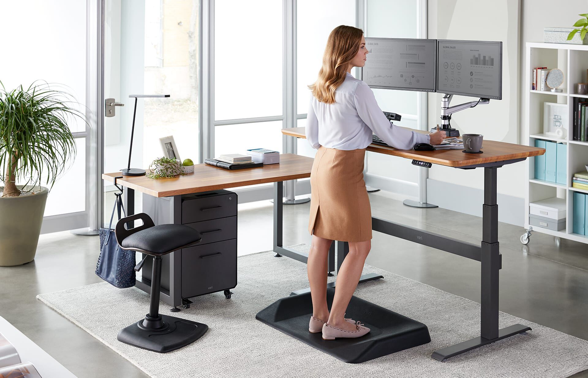 Professional working in office with Vari LED Task Lamp