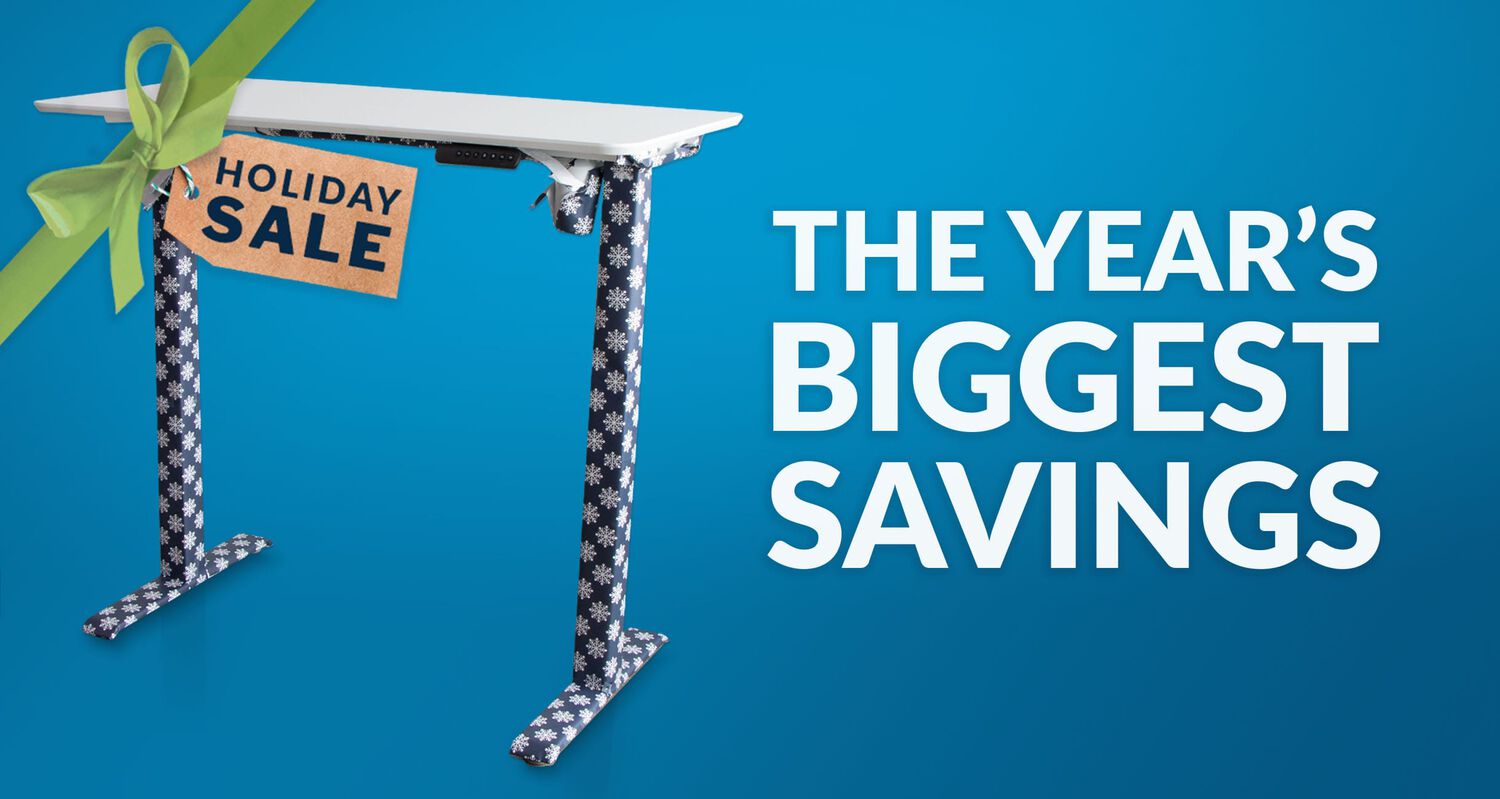 gift wrapped electric standing desk with holiday sale tag and headline the years biggest savings