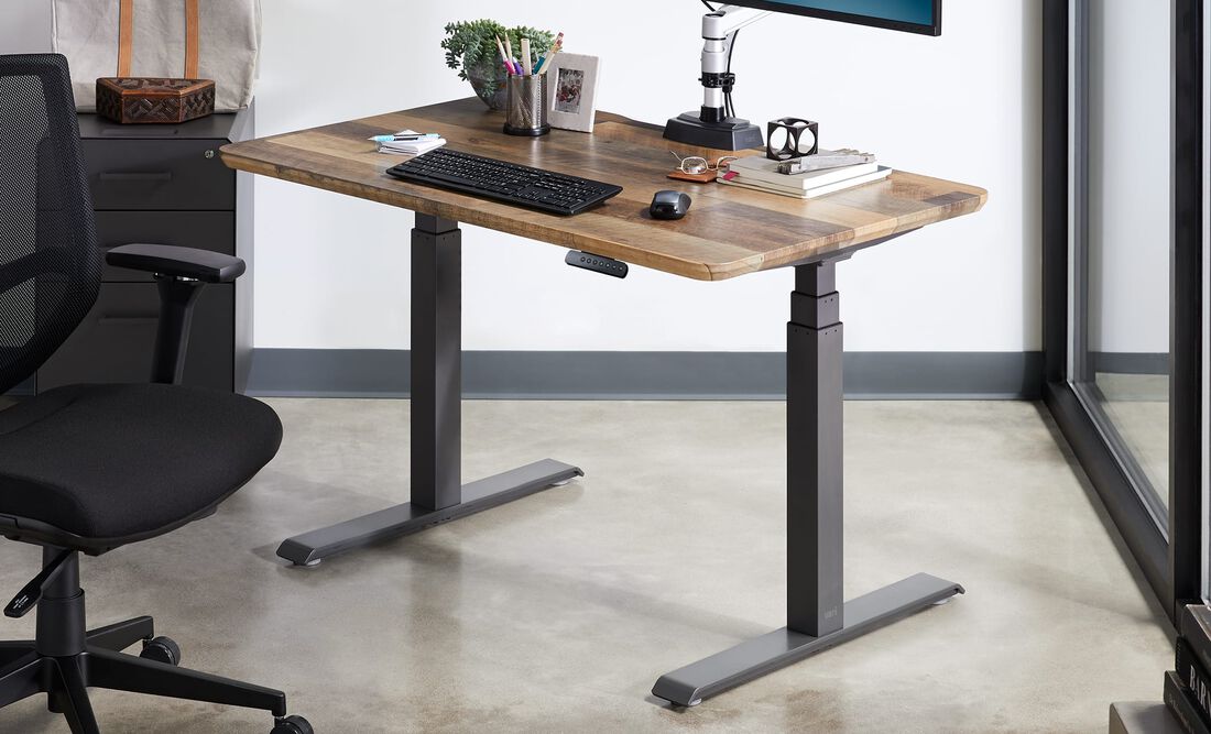 Electric Standing Desk 48x30 in lowered position in office setting