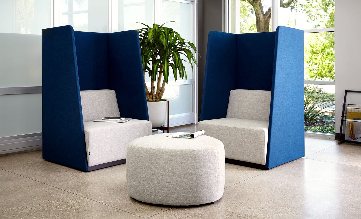 2 high back chairs and small ottoman in lounge setting