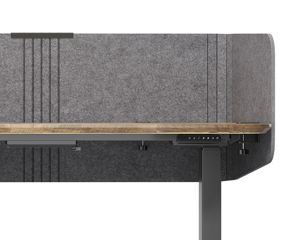 Closeup of felt privacy desk surround attached to a standing desk