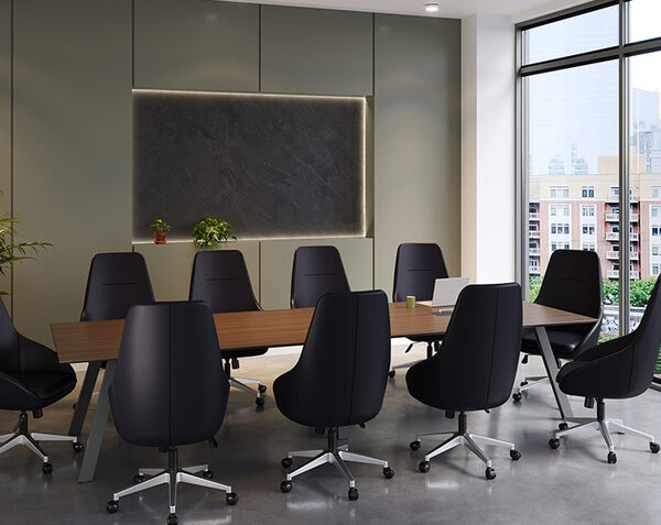 close up of chairs setup around the executive conference table in a conference room