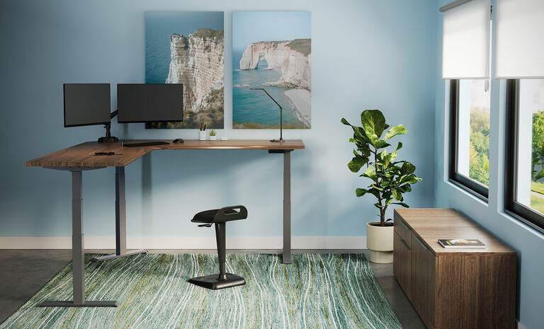 L-Shape Electric Standing Desk setup in an open workspace