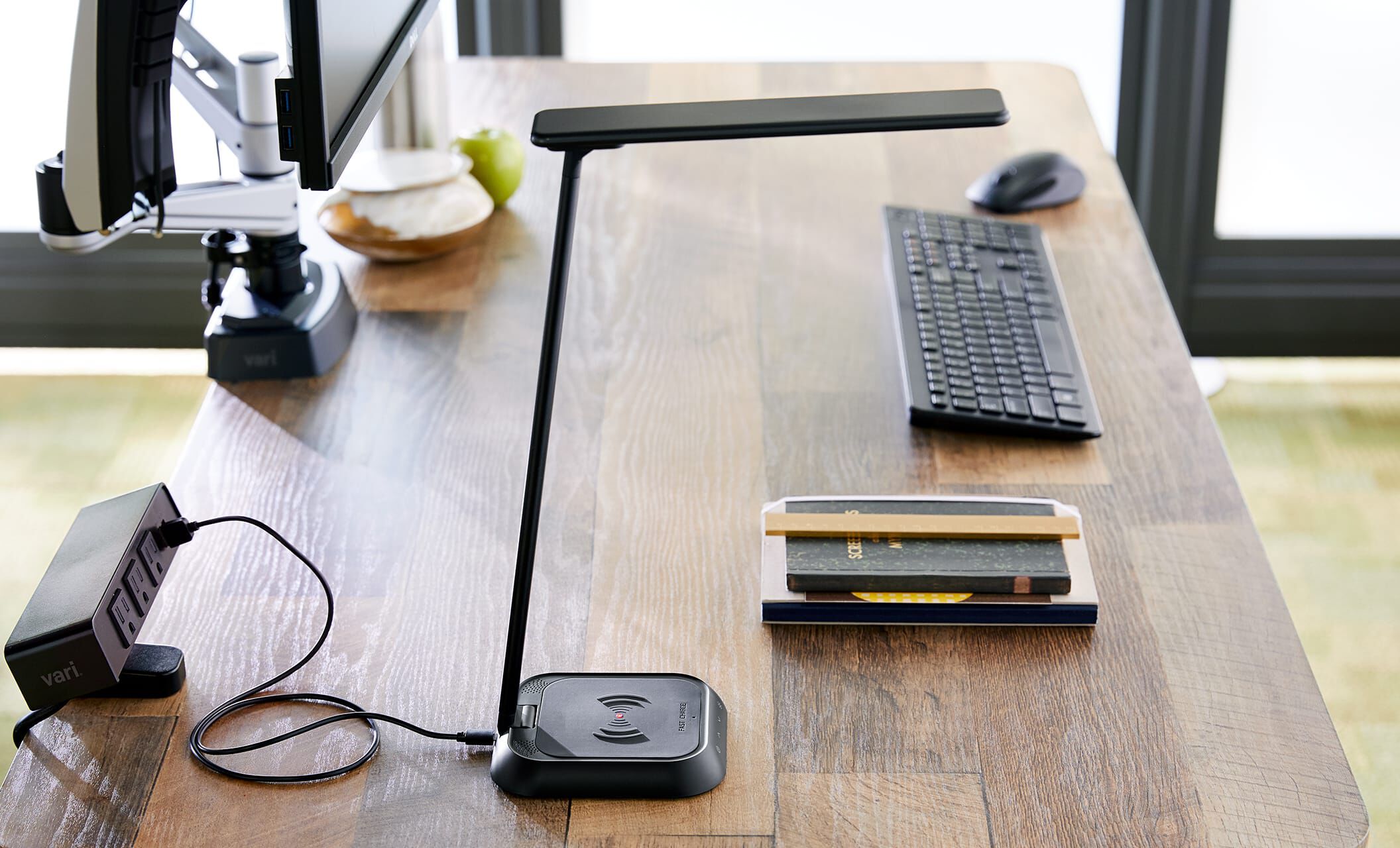 Vari LED task lamp and wireless charger on professional desk