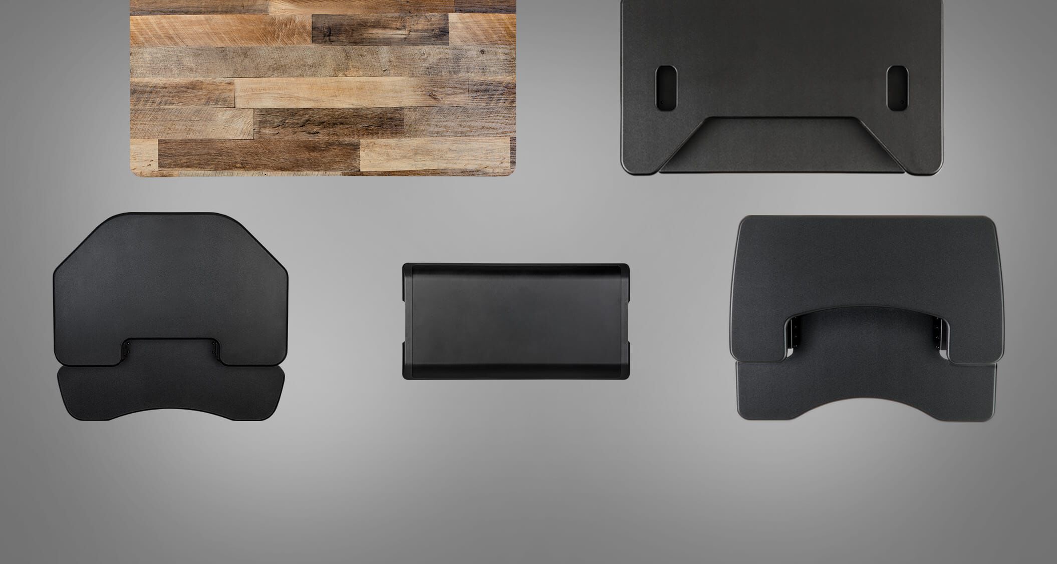 overhead view of various vari desks on grey background