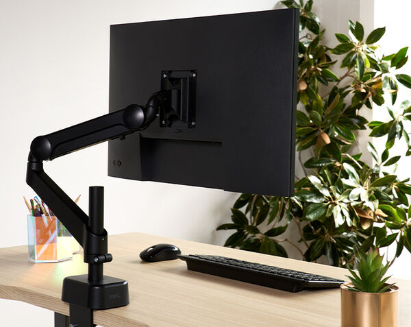 image showing the back side of a monitor arm attached to a monitor