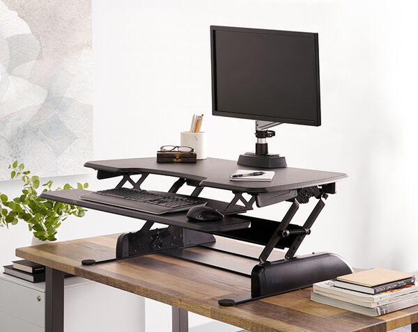 varidesk essential 36 in raised position on table