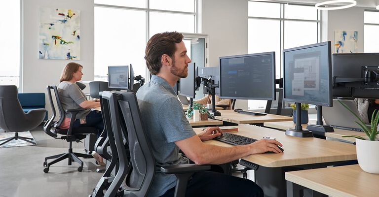 Side views of variety of standing desk solutions