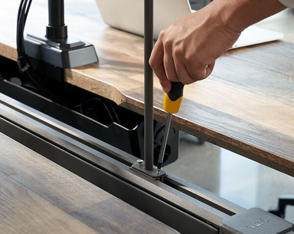 Individual installing the adapter of the beam privacy panel