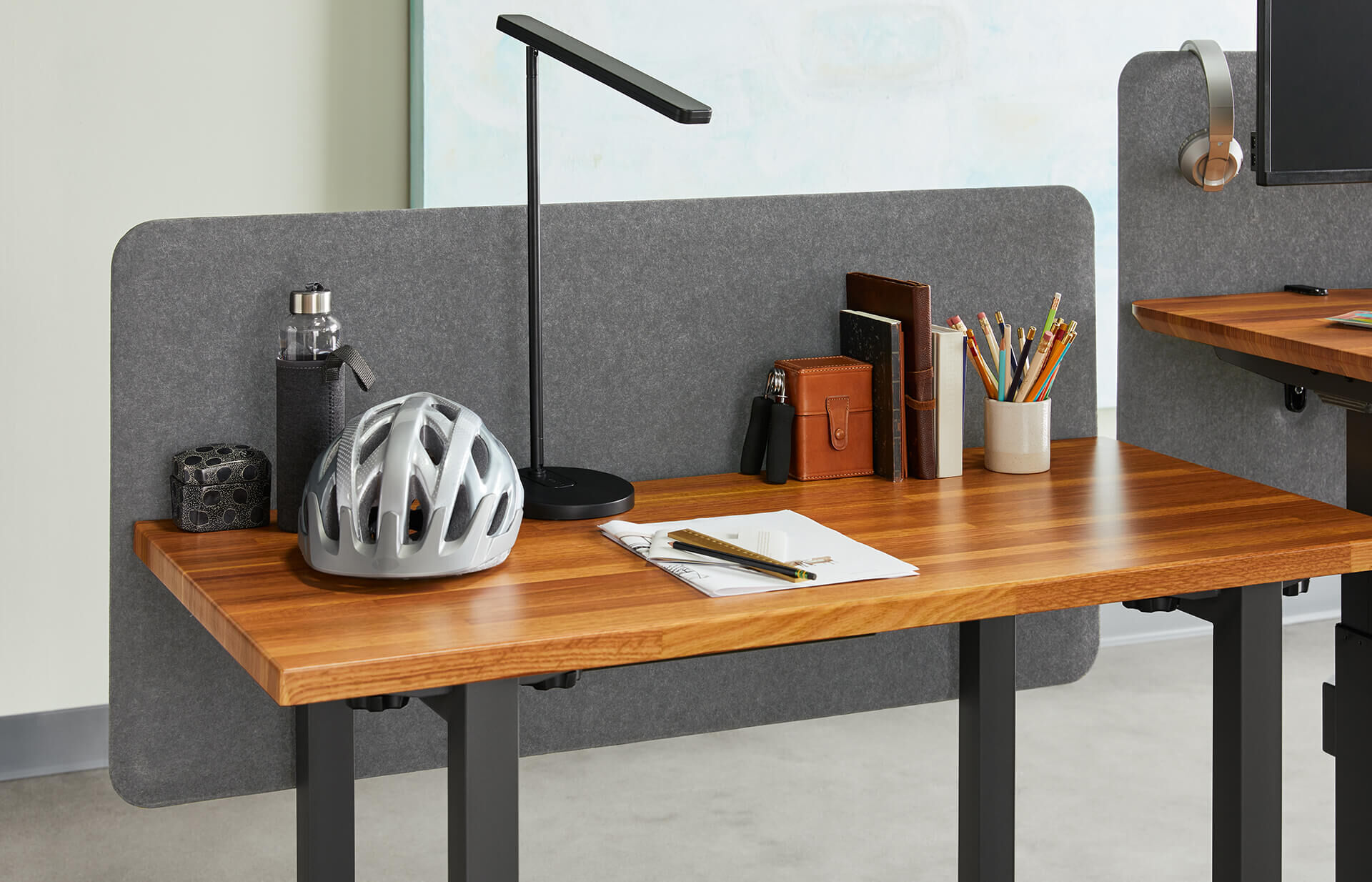 Felt Privacy+Modesty Panel 60 is seen in an open office, attached to each desk in a pack of 6, so that each desk has enhanced privacy and sound dampening
