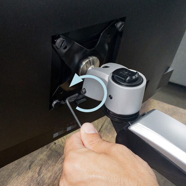 loosening tilt and rotation bolt to reposition monitors