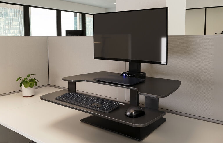 varidesk premier single converter in an office cubicle setup
