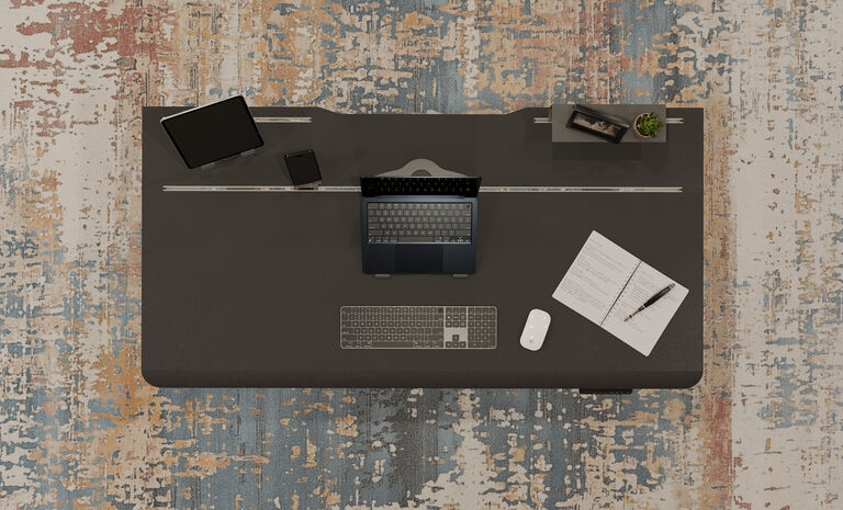 overhead view of tech track accessories in the tech track electric standing desk