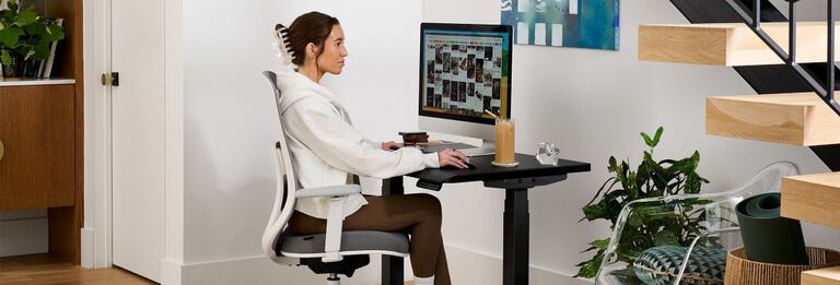 Women sitting at desk in at home setting