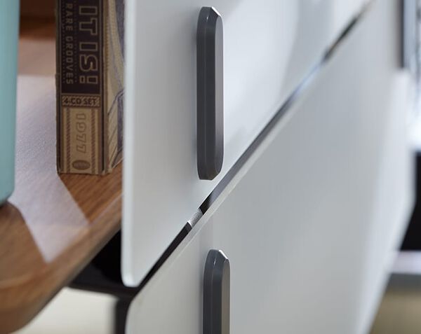 close up of two acrylic modesty panels attached to a desk