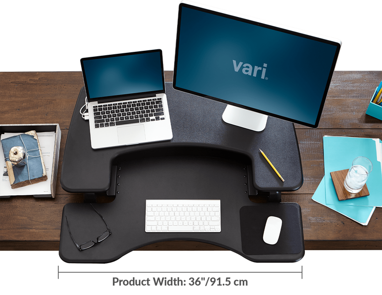 Black VariDesk Converter lowered on existing desk
