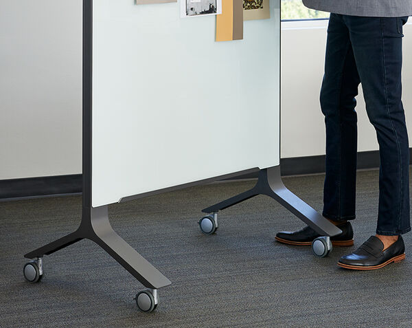 professional standing next to mobile glass board 40x72