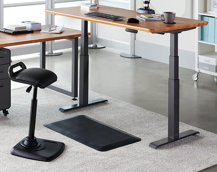 mat seen fitting perfectly between legs of Electric Standing Desk 48x30