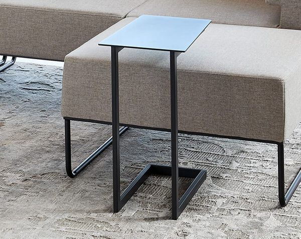 laptop side table tucked into sectional sofa