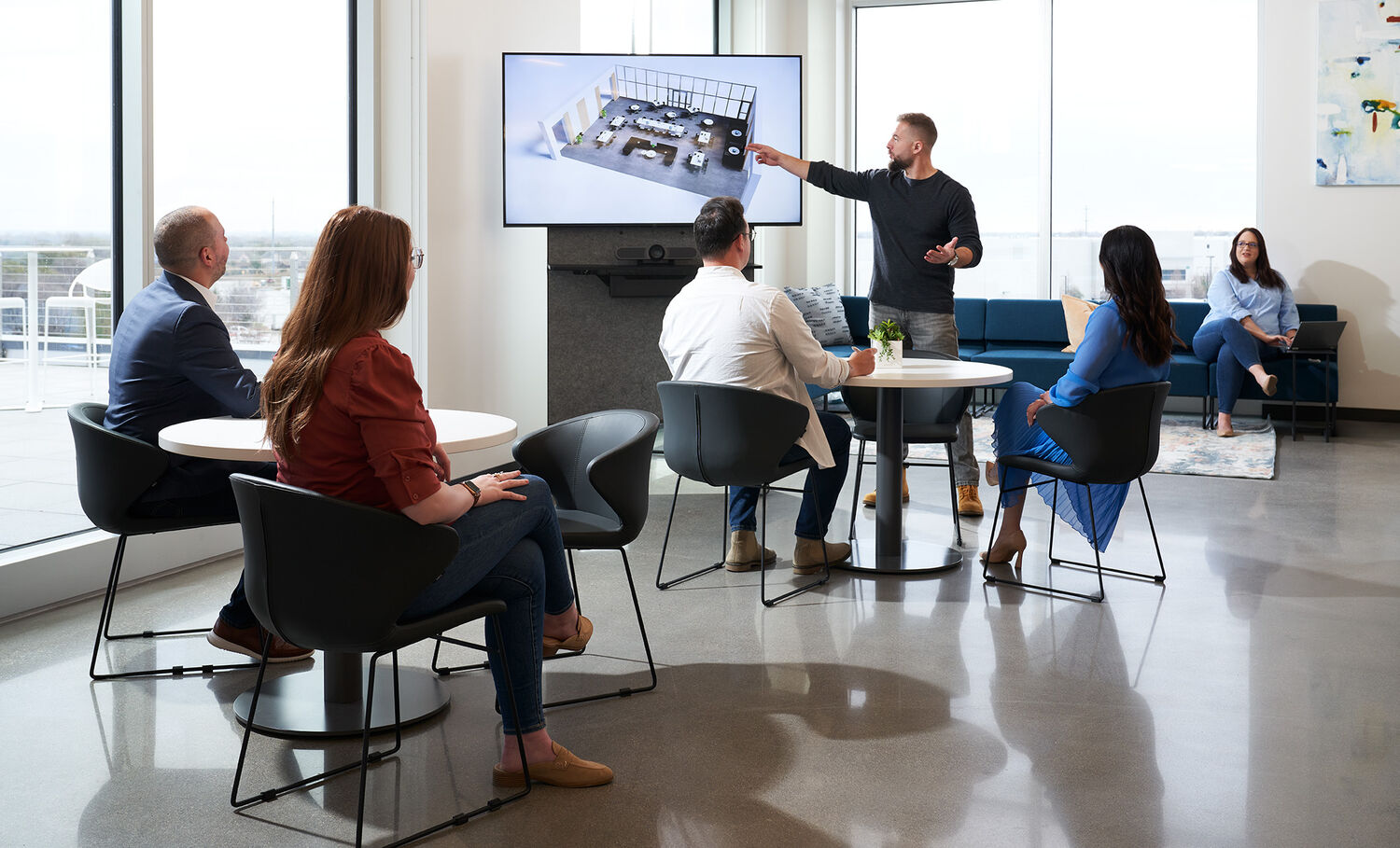vari mobile media station shown with a TV mounted and in use during a presentation