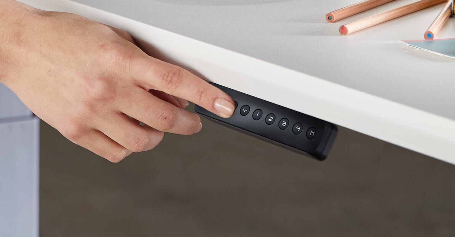 memory presets being used on a control panel of a vari electric standing desk