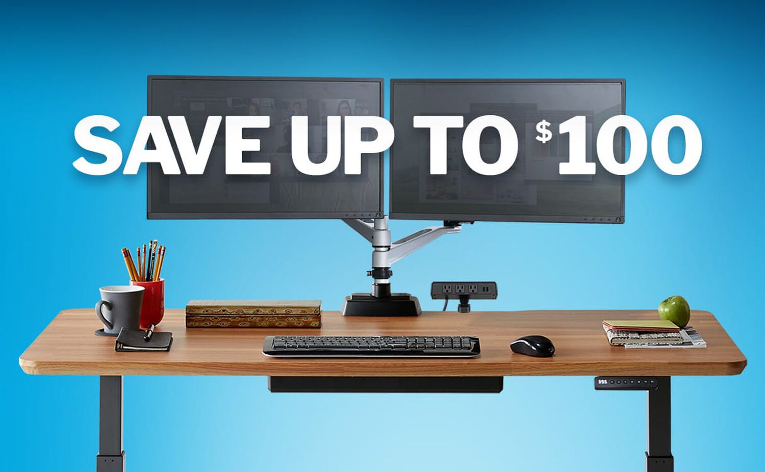 electric standing desk with two monitors appearing with a blue background and text that says save up to one hundred dollars
