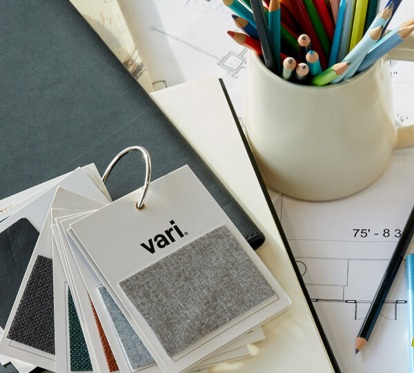 overhead view of a desk with papers and color swatches sitting on top