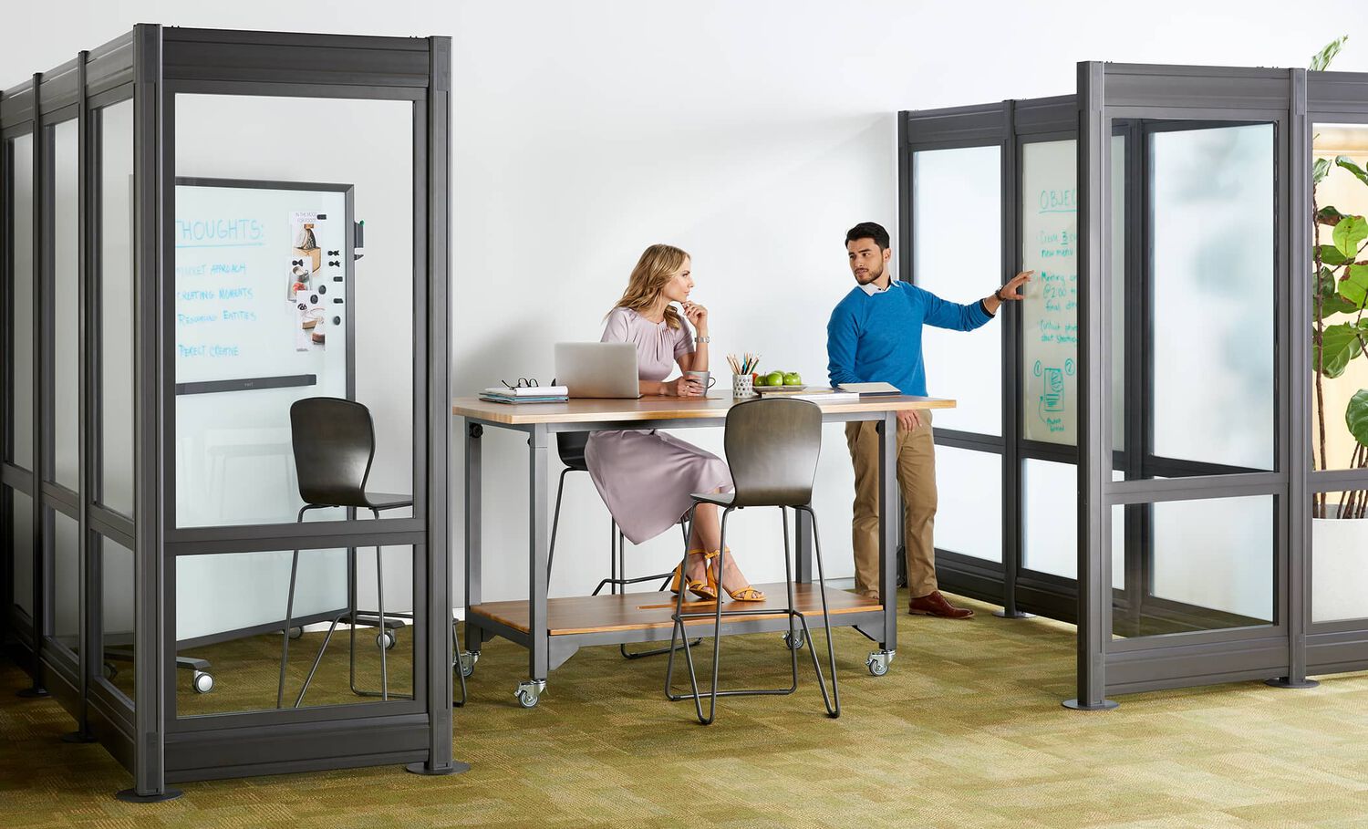 2 professionals meeting in conference room built with quickflex walls