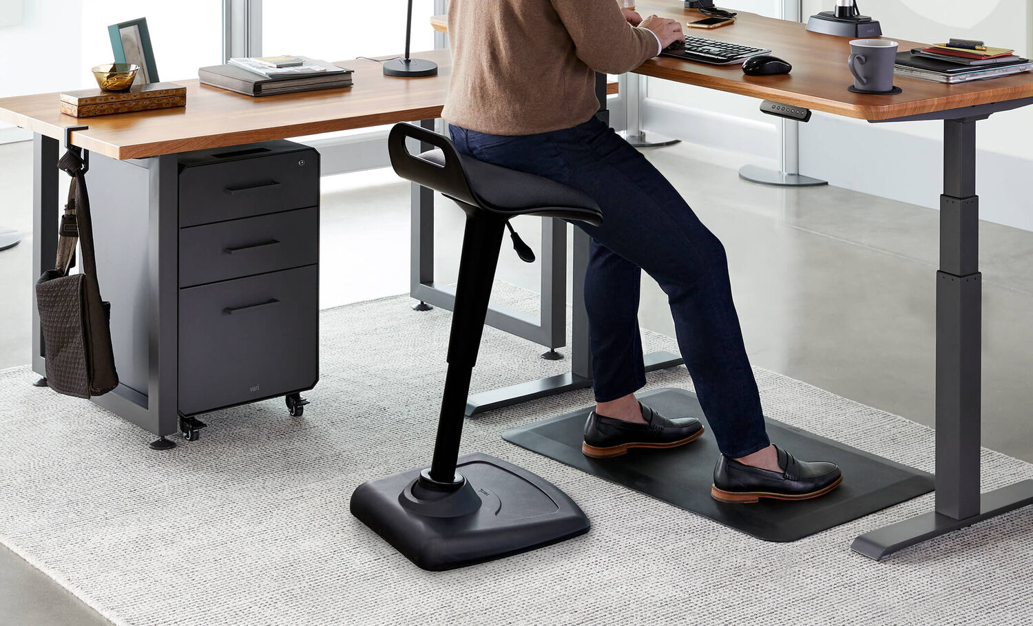 Professional seated on Vari Active Seat in office setting