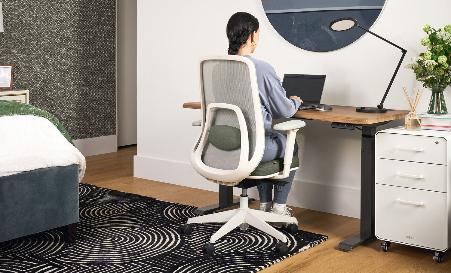 professional sitting in home office setting with ascent chair