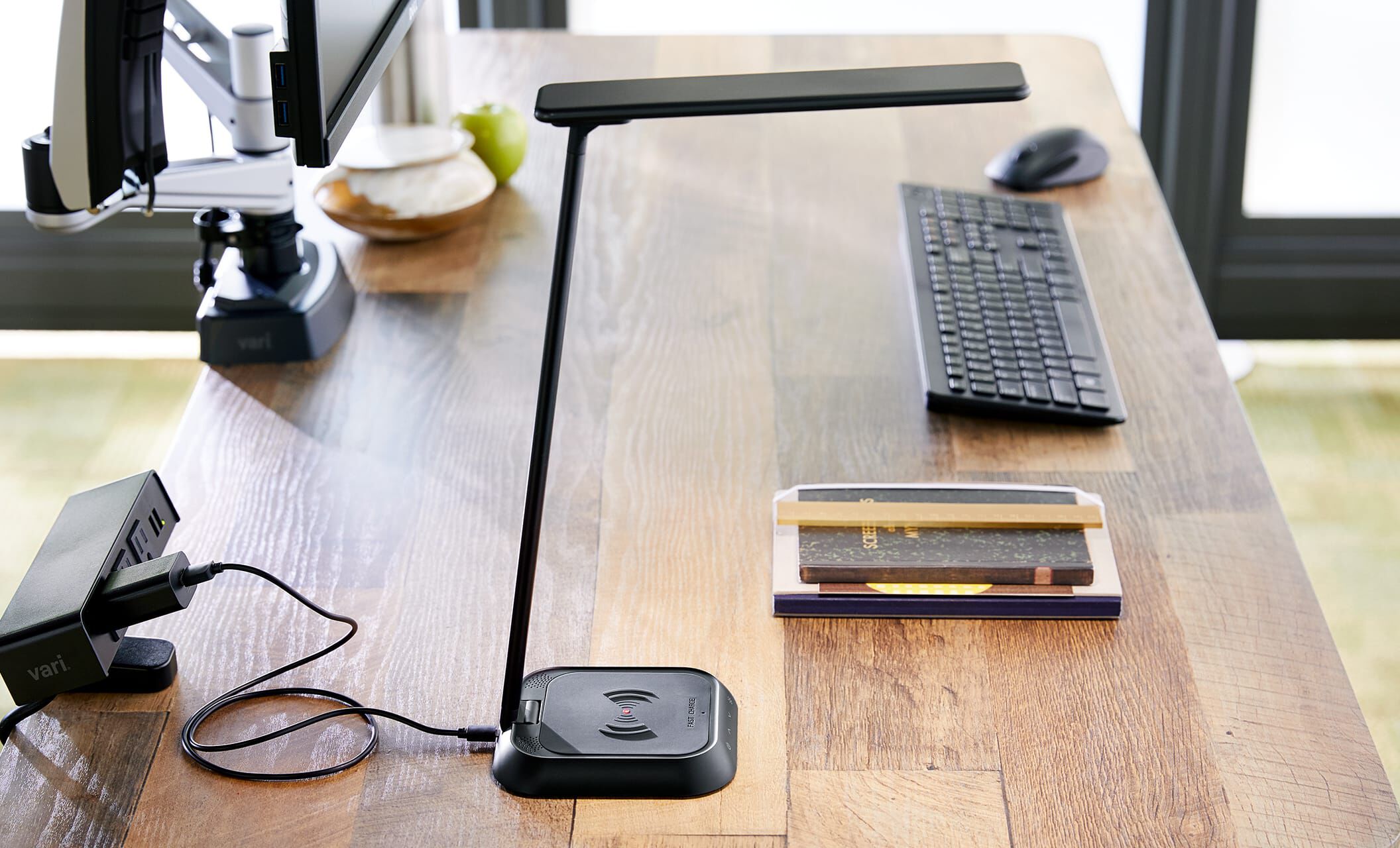 Vari LED task lamp and wireless charger on professional desk