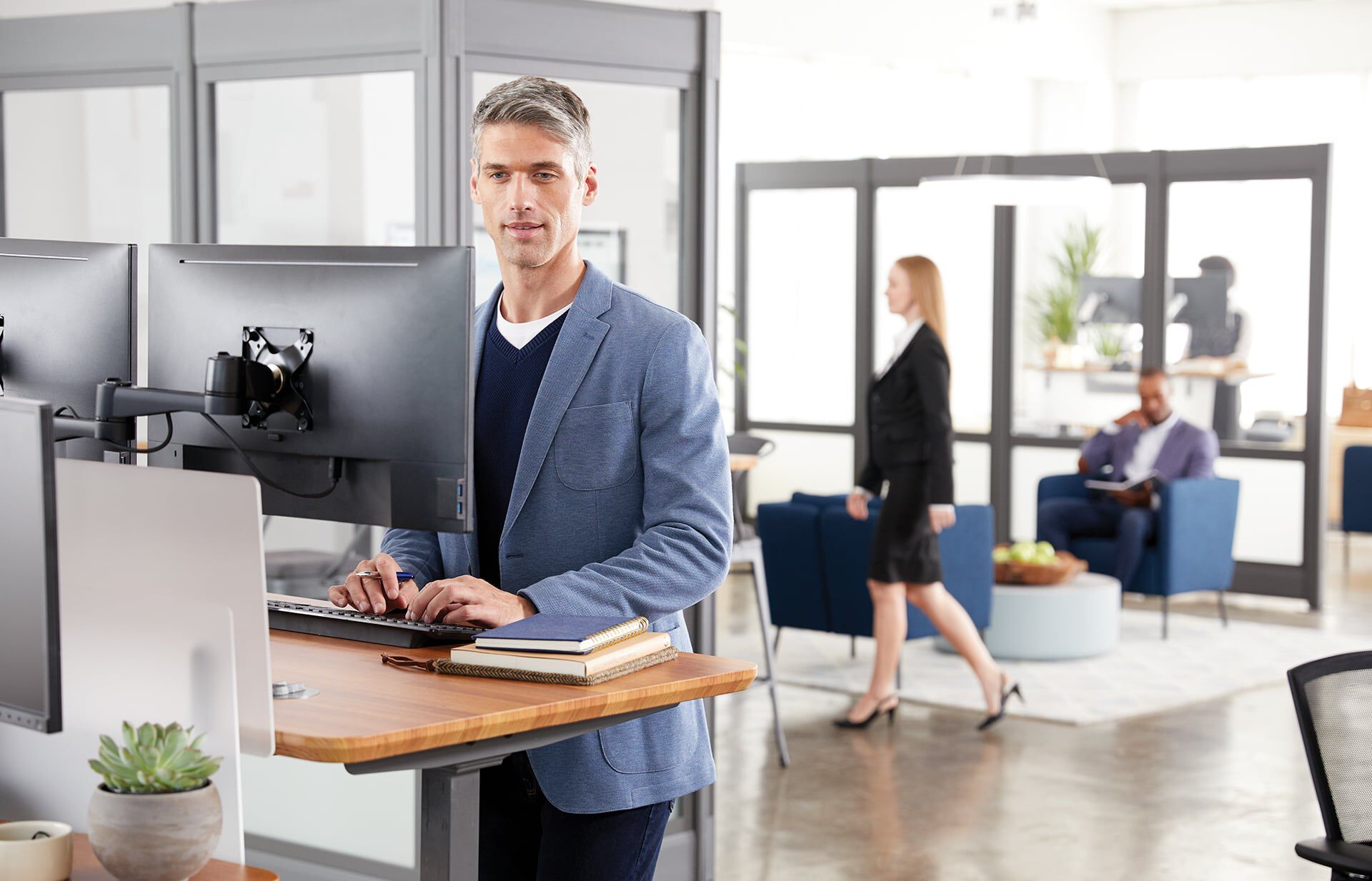 Individual working in office with vari products