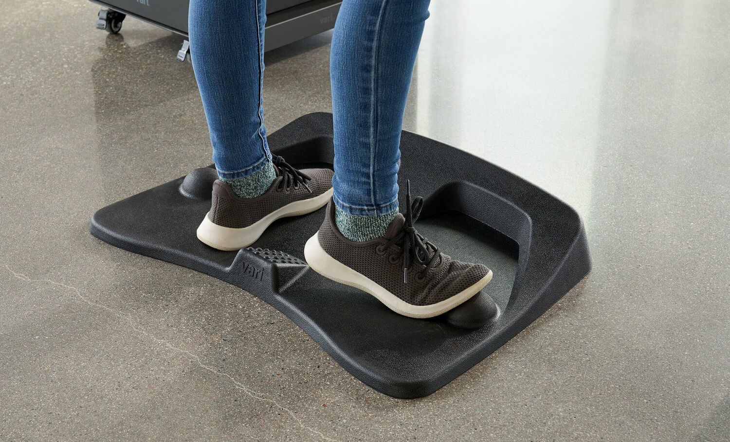 Individual standing on the Activemat with shoes on