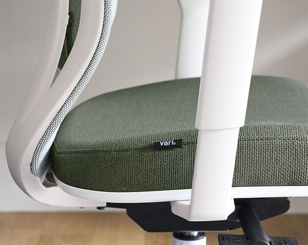 Close-up of Ascent chair lever beneath the seat for reclining or tilt adjustment.