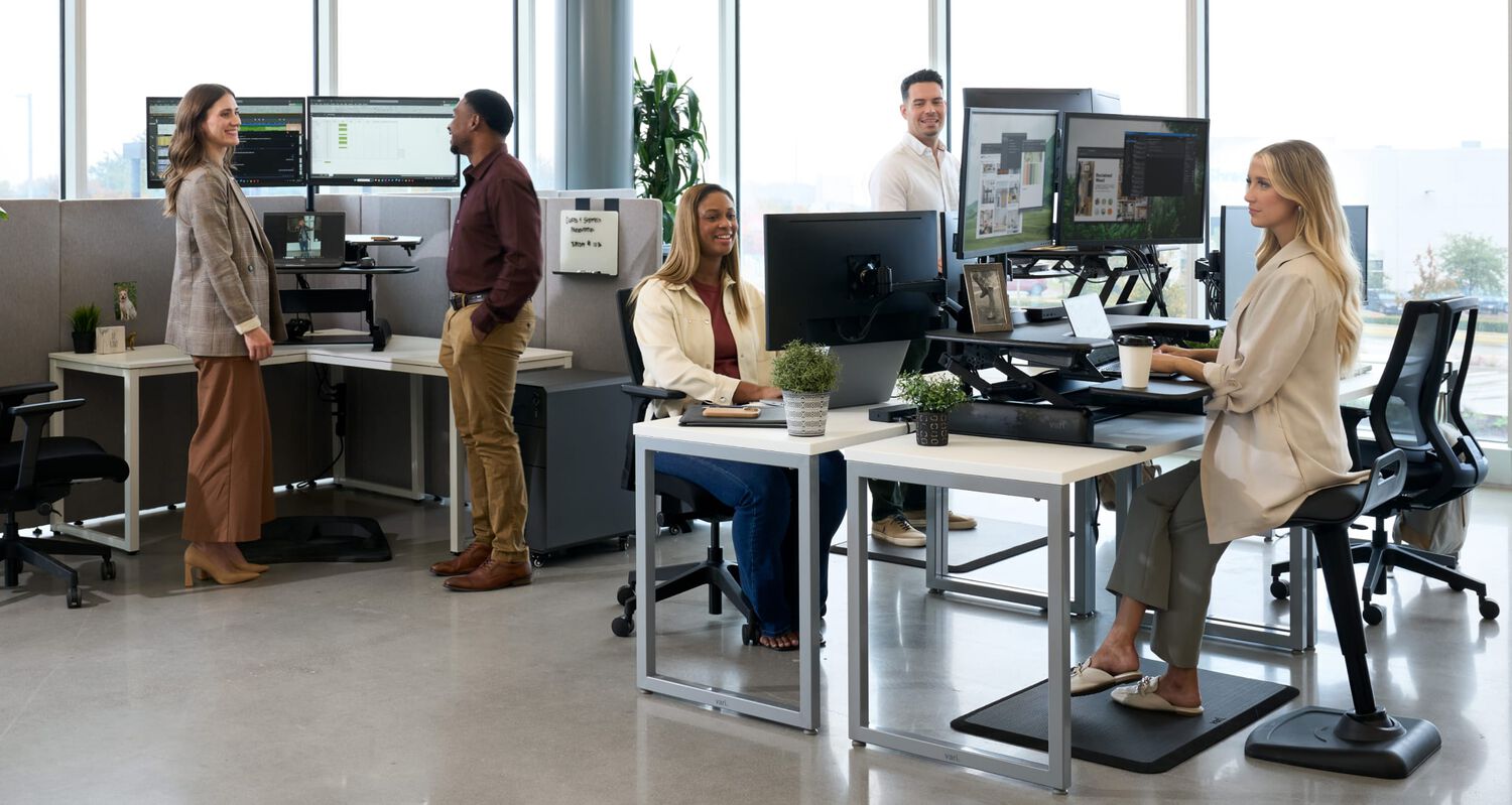sit stand sale displaying vari standing desk and studio lamp
