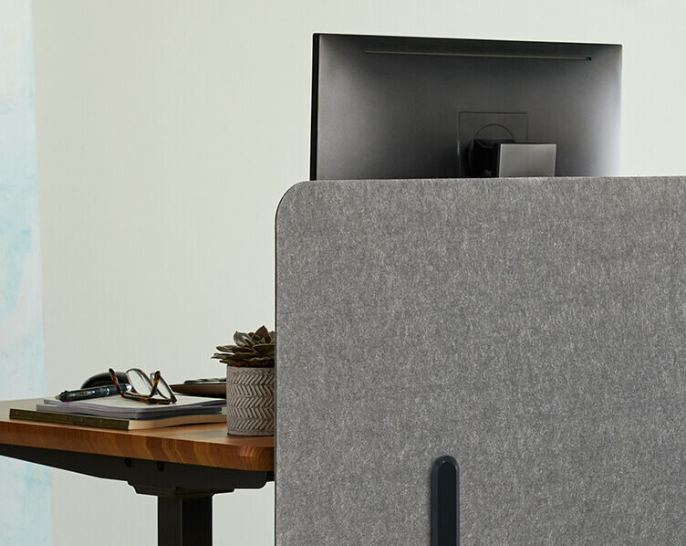 close up of vari felt panel in light grey mounted on desk