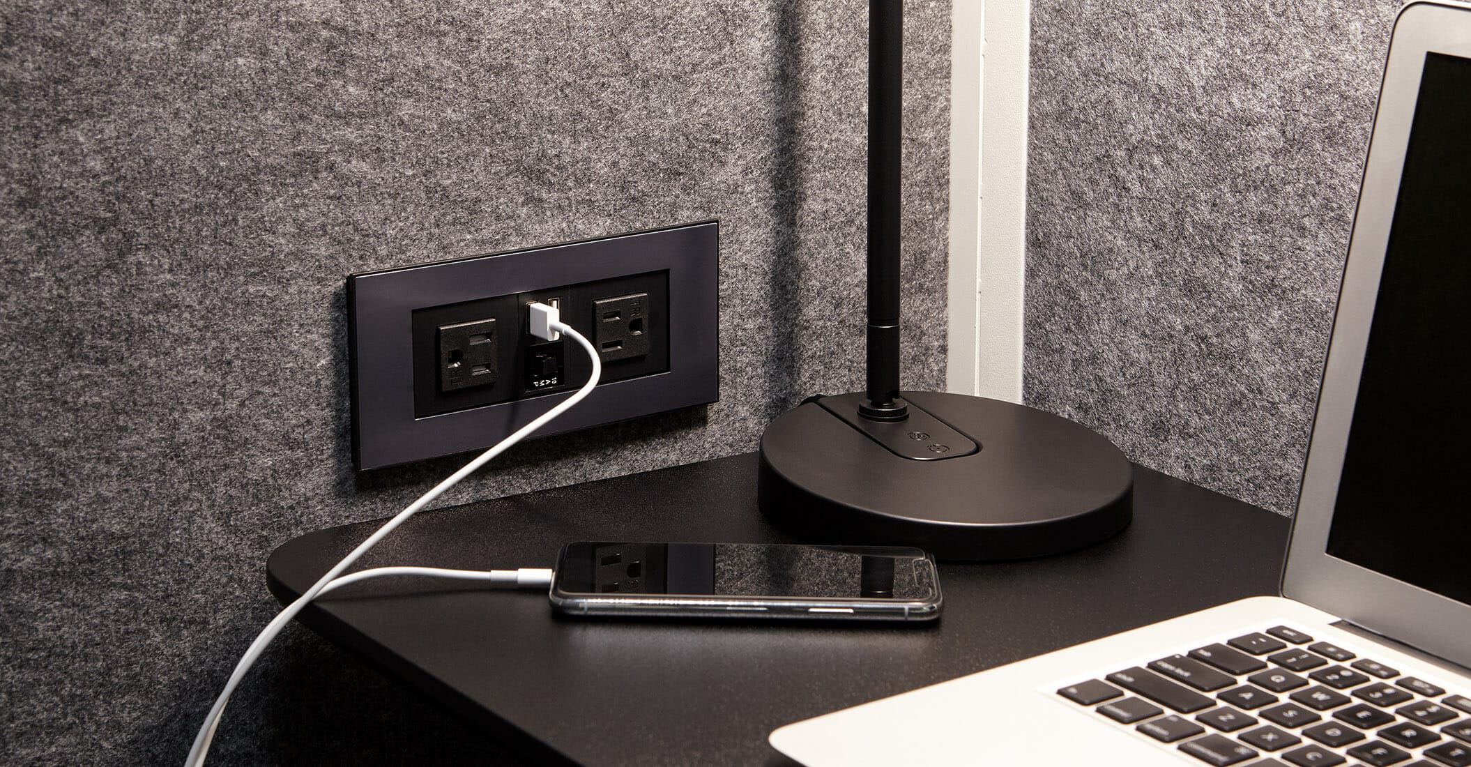 mobile phone charging in USB power outlet within the vari privacy booth